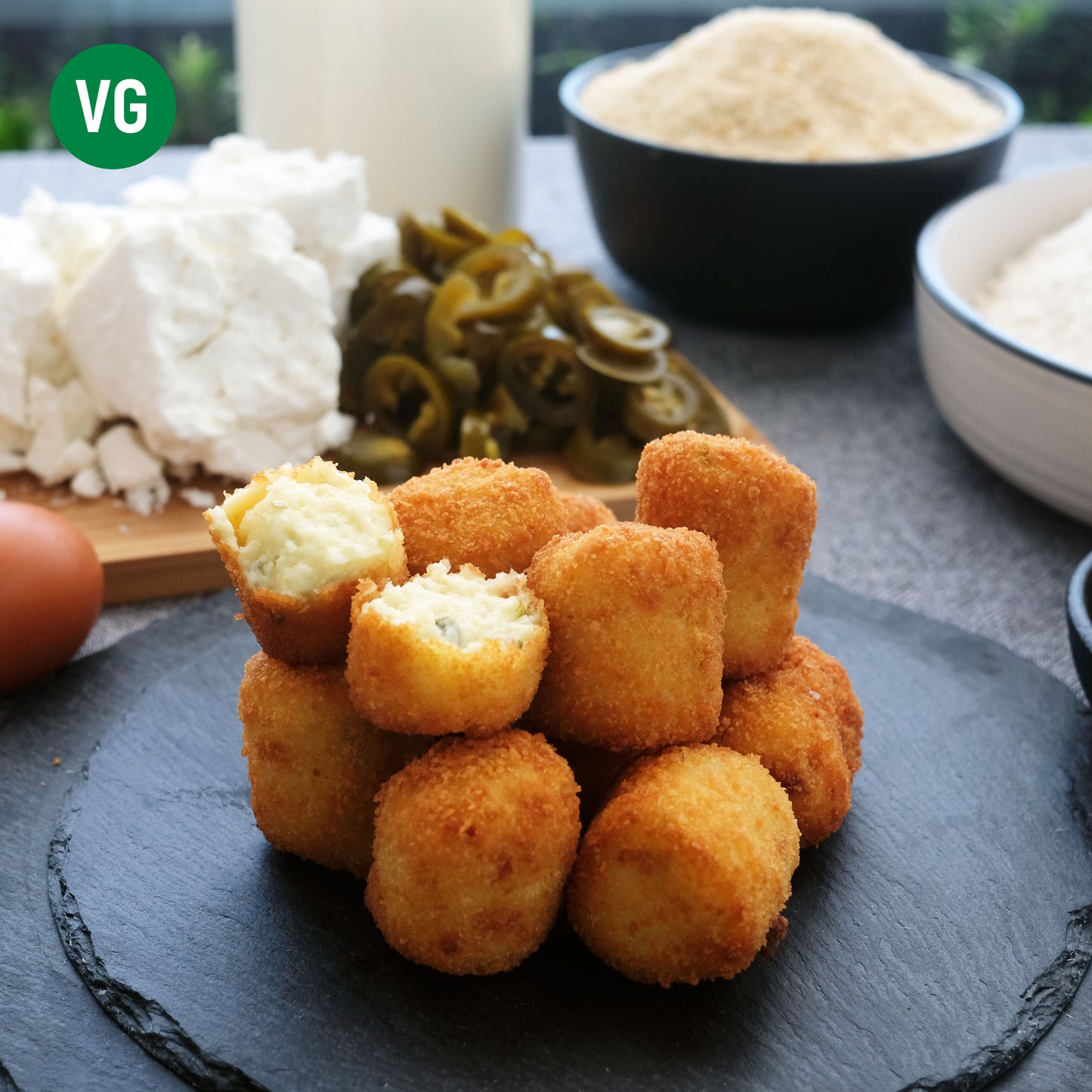 Goat cheese and jalapeno croquetas with egg, breadcrumbs, flour, milk.